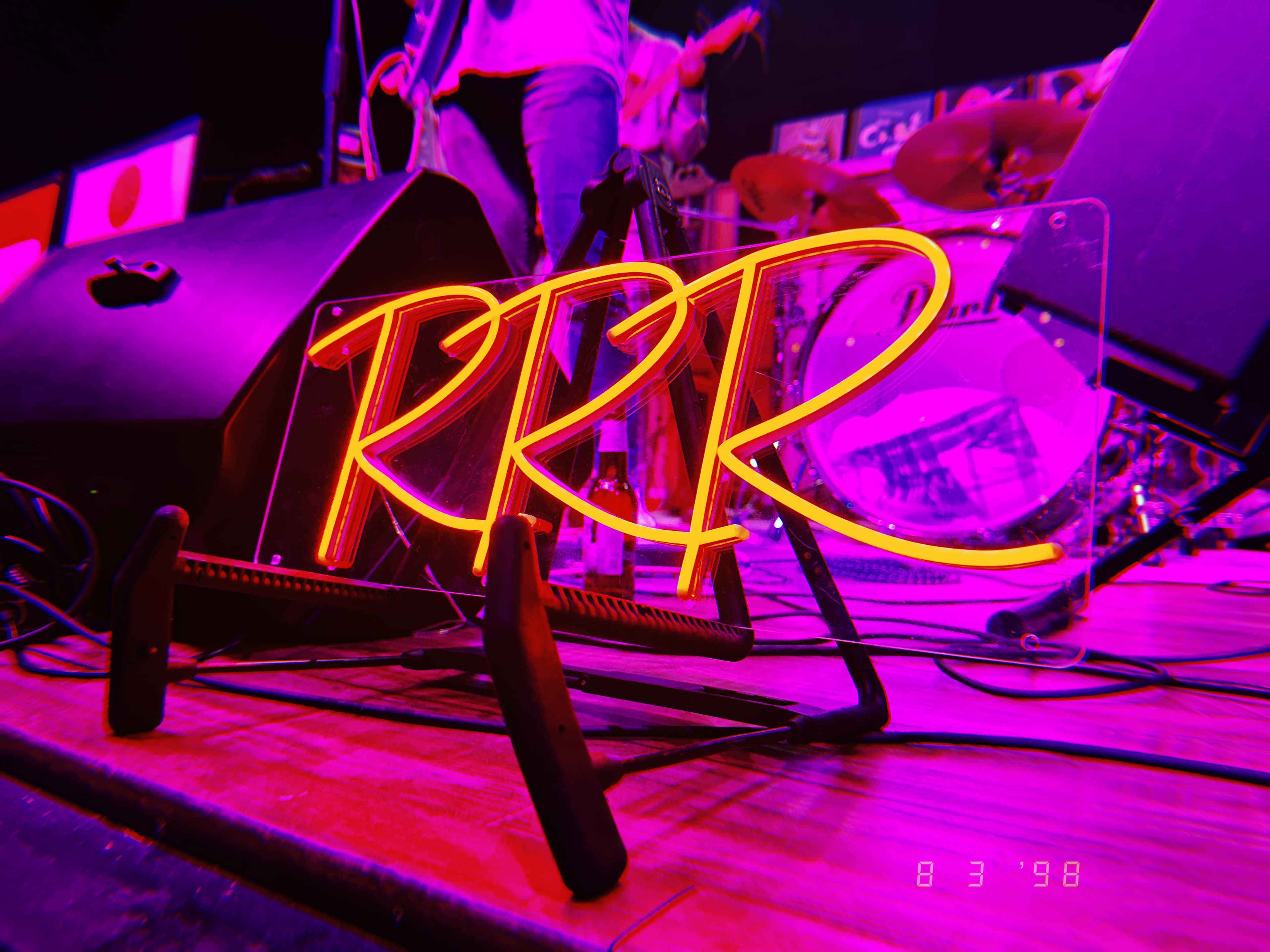 A neon sign with the letters R R R